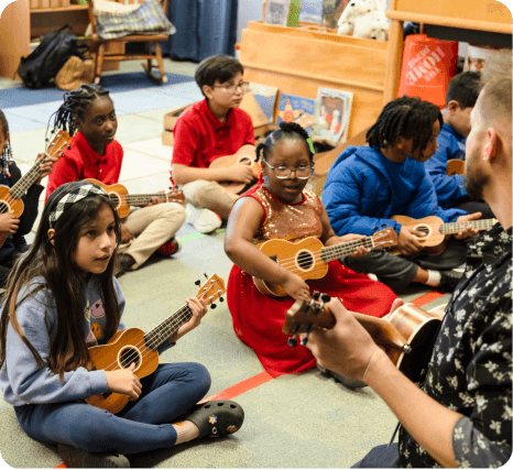 Students learning music together